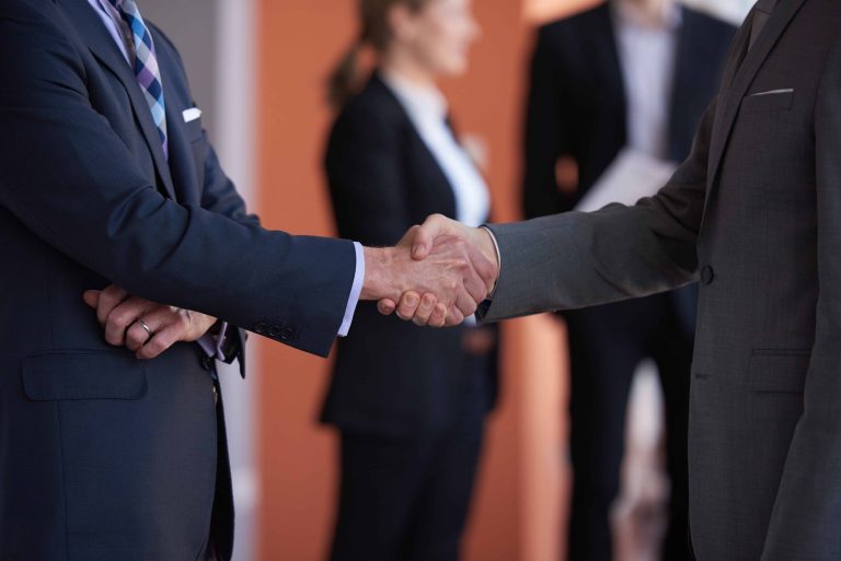 business partners, partnership concept with two businessman handshake